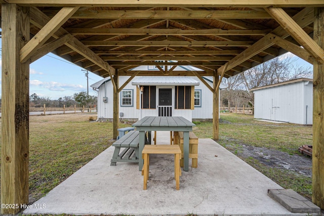 view of patio featuring a shed