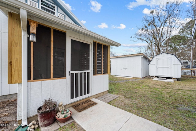 doorway to property with a lawn