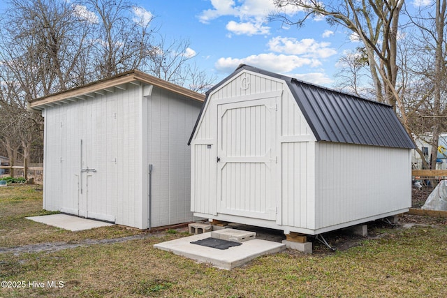 view of outbuilding featuring a lawn