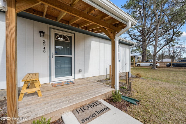 entrance to property with a yard