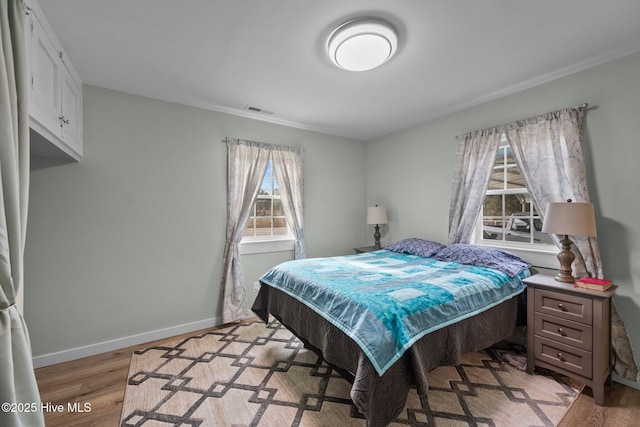 bedroom with light wood-type flooring