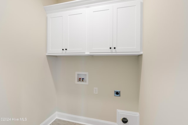 laundry room with cabinets, hookup for a washing machine, and electric dryer hookup