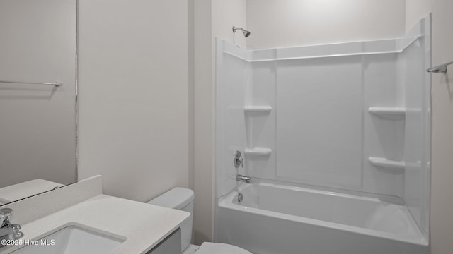 full bathroom with bathing tub / shower combination, vanity, and toilet