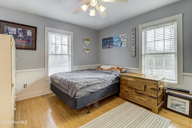 bedroom featuring light hardwood / wood-style floors and ceiling fan