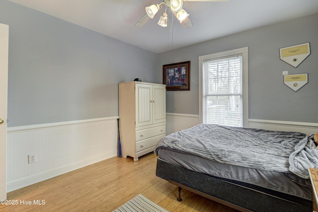 bedroom featuring ceiling fan and light wood-type flooring