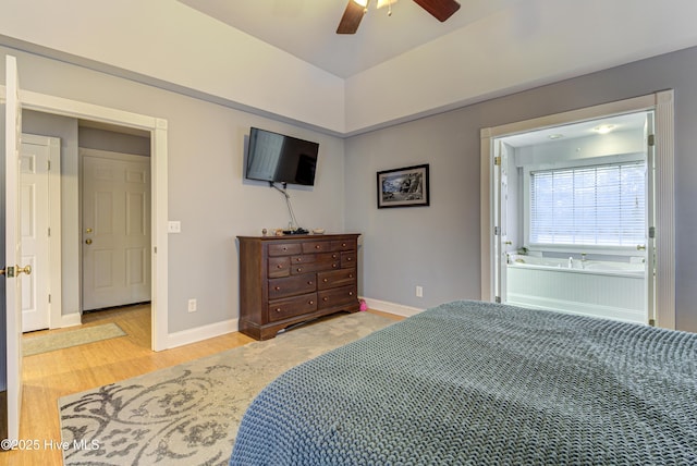 bedroom with ensuite bath, ceiling fan, and light wood-type flooring