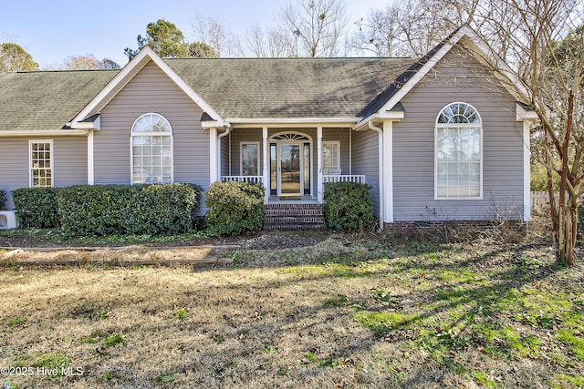 ranch-style home with a porch and a front yard