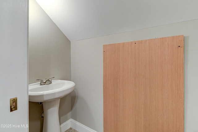 bathroom with vaulted ceiling