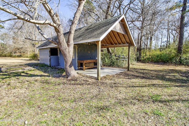 view of property exterior featuring an outbuilding