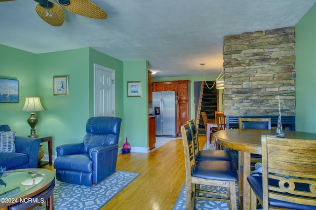 1981 New River Inlet Rd, North Topsail Beach, NC 28460 - living area featuring stairway, light wood finished floors, and a fireplace