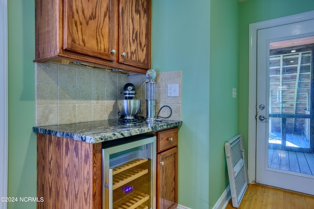 1981 New River Inlet Rd, North Topsail Beach, NC 28460 - indoor dry bar featuring wine cooler, backsplash, light wood finished floors, and heating unit