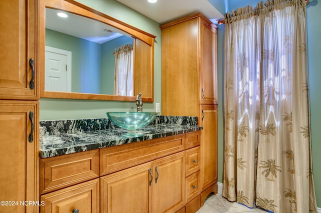 1981 New River Inlet Rd, North Topsail Beach, NC 28460 - bathroom with vanity and tile patterned flooring