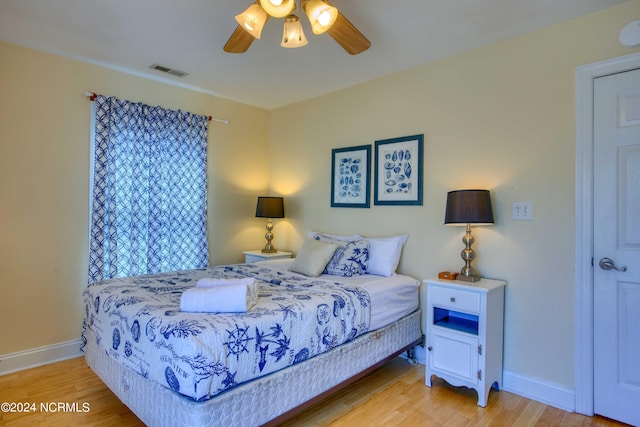 1981 New River Inlet Rd, North Topsail Beach, NC 28460 - bedroom with light wood finished floors and a ceiling fan