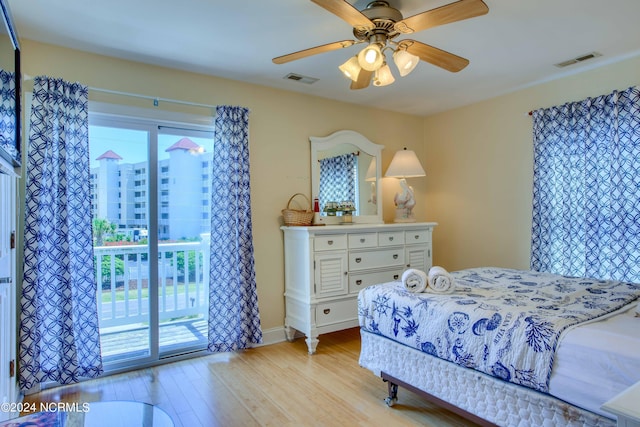 1981 New River Inlet Rd, North Topsail Beach, NC 28460 - bedroom with access to outside, light wood-style floors, multiple windows, and ceiling fan