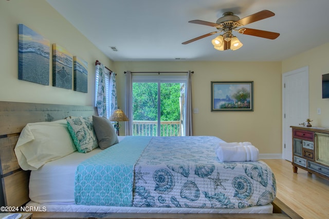 1981 New River Inlet Rd, North Topsail Beach, NC 28460 - bedroom with access to outside, wood finished floors, and ceiling fan