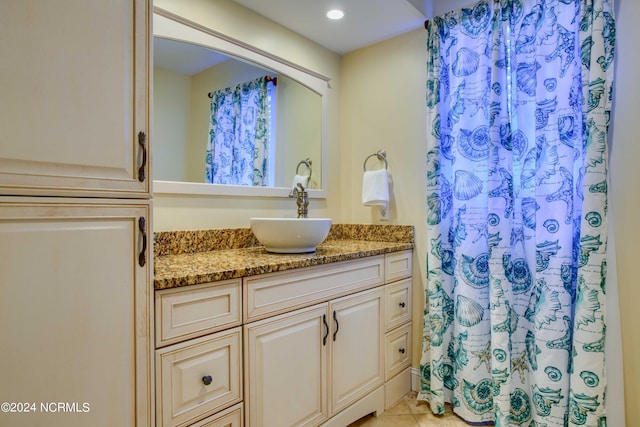 1981 New River Inlet Rd, North Topsail Beach, NC 28460 - bathroom featuring vanity, curtained shower, tile patterned flooring, and recessed lighting