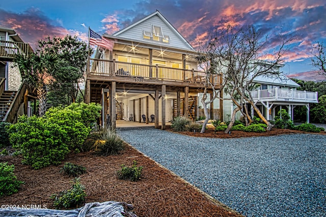 view of front of house featuring a carport and covered porch