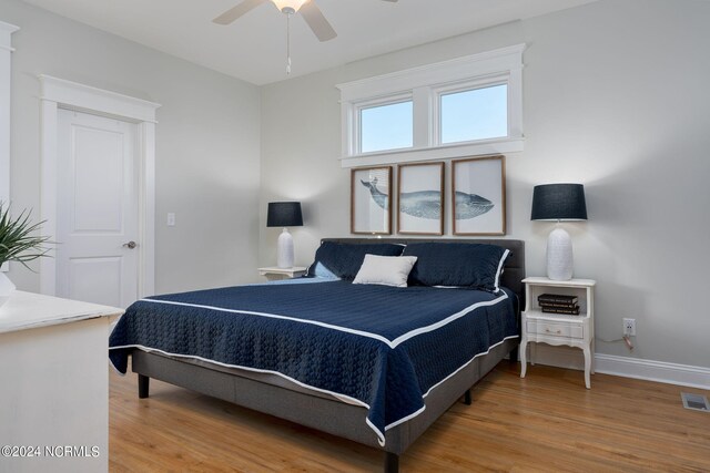 bedroom featuring hardwood / wood-style flooring and ceiling fan