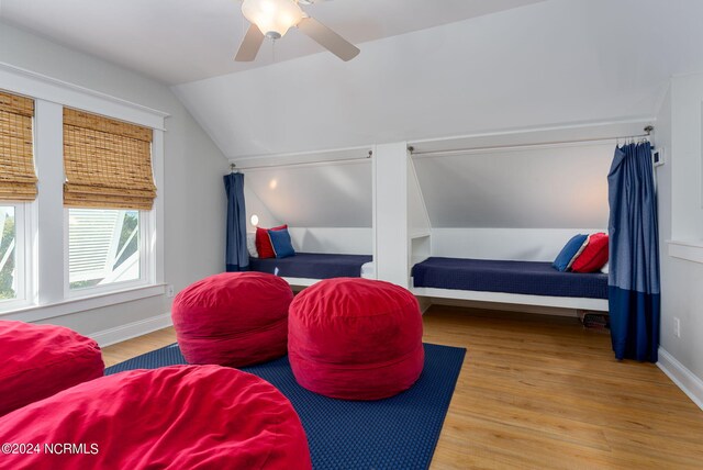 sitting room featuring vaulted ceiling, ceiling fan, and light hardwood / wood-style flooring