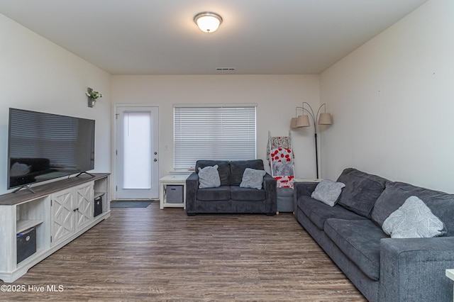 living room with dark wood-type flooring