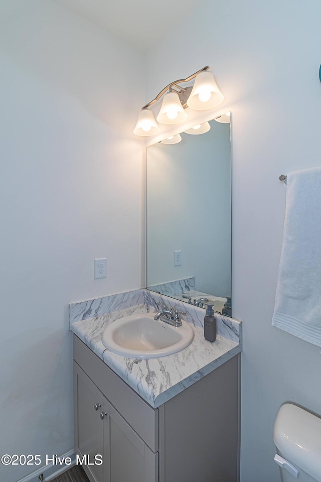 bathroom with vanity and toilet