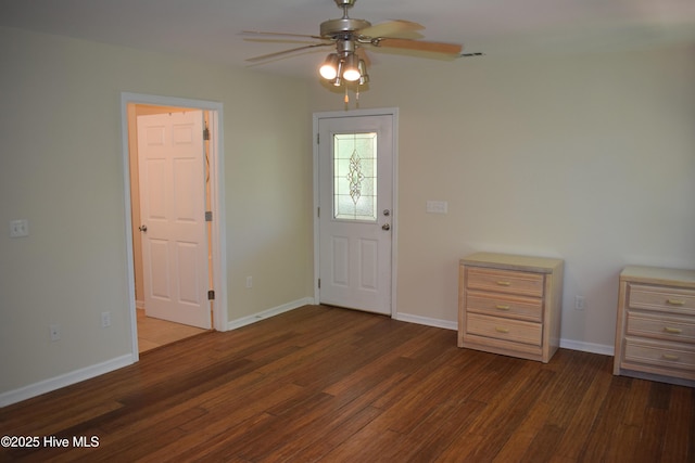 7304 E Oak Island Dr, Oak Island, NC 28465 - entrance foyer featuring wood finished floors, a ceiling fan, and baseboards