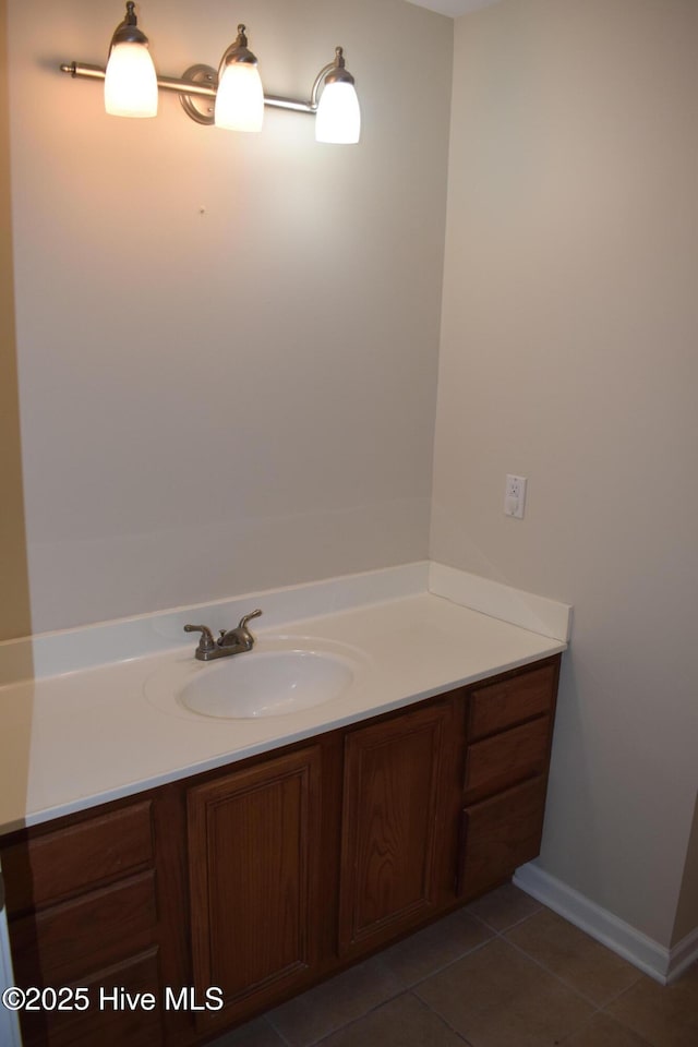 7304 E Oak Island Dr, Oak Island, NC 28465 - bathroom featuring vanity, tile patterned flooring, and baseboards