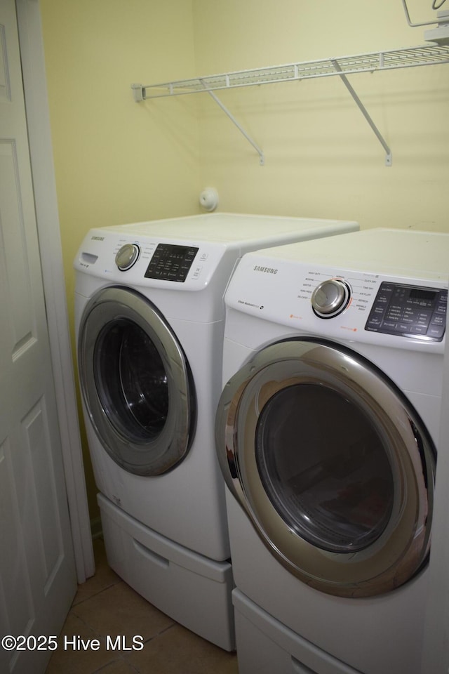 7304 E Oak Island Dr, Oak Island, NC 28465 - washroom featuring washing machine and dryer and tile patterned floors