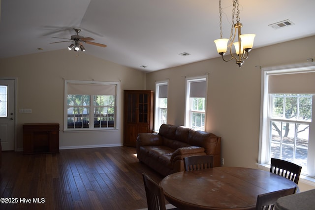 7304 E Oak Island Dr, Oak Island, NC 28465 - dining room featuring plenty of natural light, wood-type flooring, vaulted ceiling, ceiling fan, and a chandelier