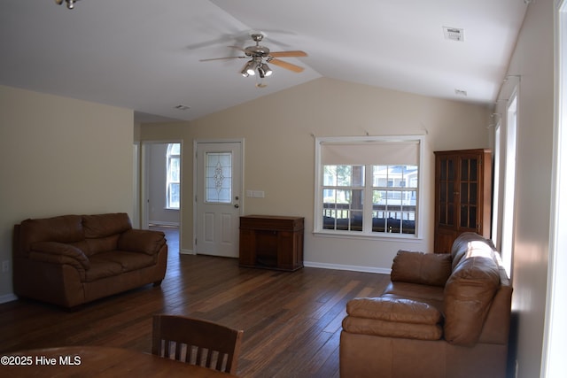 7304 E Oak Island Dr, Oak Island, NC 28465 - living area featuring healthy amount of natural light, wood-type flooring, a ceiling fan, lofted ceiling, and baseboards
