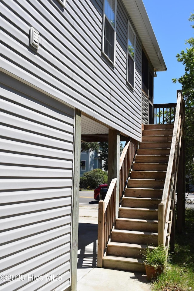 7304 E Oak Island Dr, Oak Island, NC 28465 - view of home's exterior featuring stairs