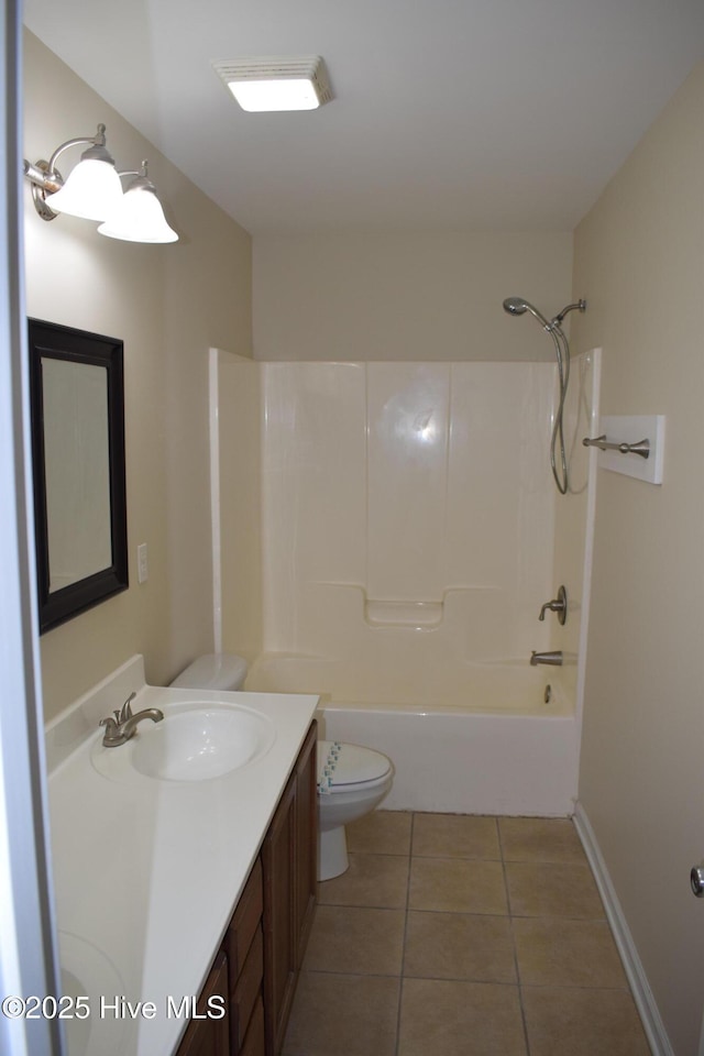 7304 E Oak Island Dr, Oak Island, NC 28465 - full bath featuring toilet, tile patterned floors, vanity, and shower / bath combination