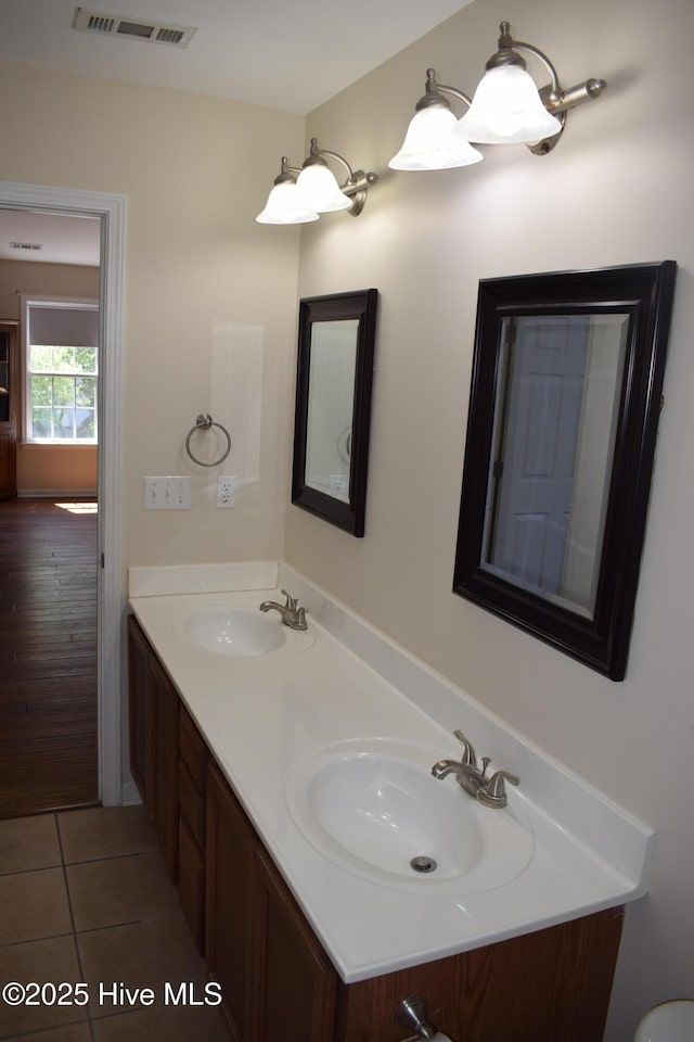 7304 E Oak Island Dr, Oak Island, NC 28465 - bathroom featuring double vanity and tile patterned floors