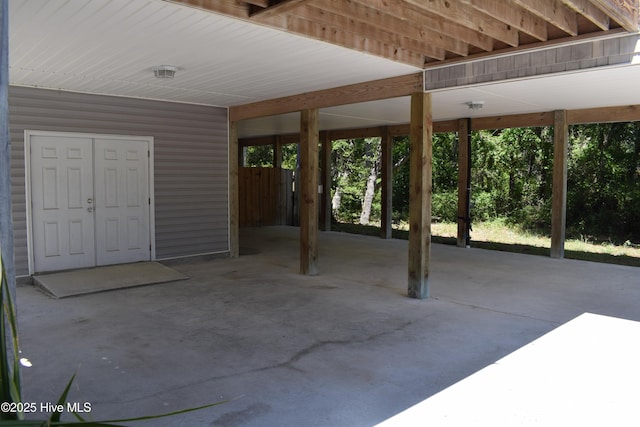 7304 E Oak Island Dr, Oak Island, NC 28465 - view of patio / terrace featuring an attached carport