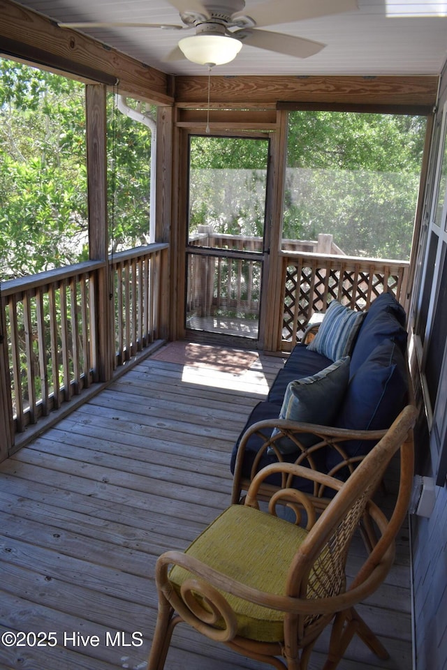 7304 E Oak Island Dr, Oak Island, NC 28465 - deck with a ceiling fan