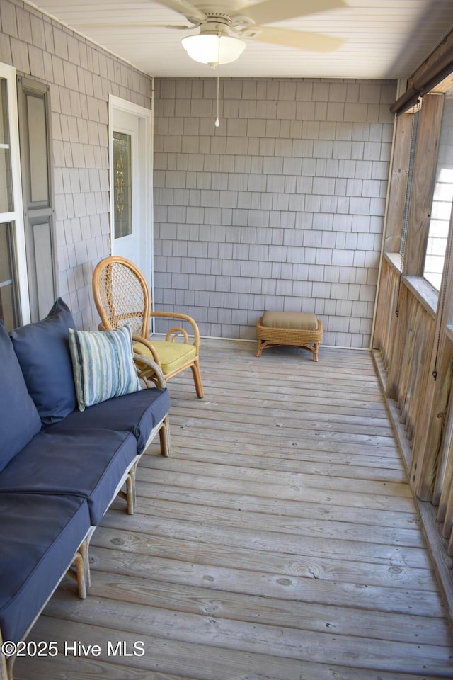 7304 E Oak Island Dr, Oak Island, NC 28465 - deck featuring a ceiling fan
