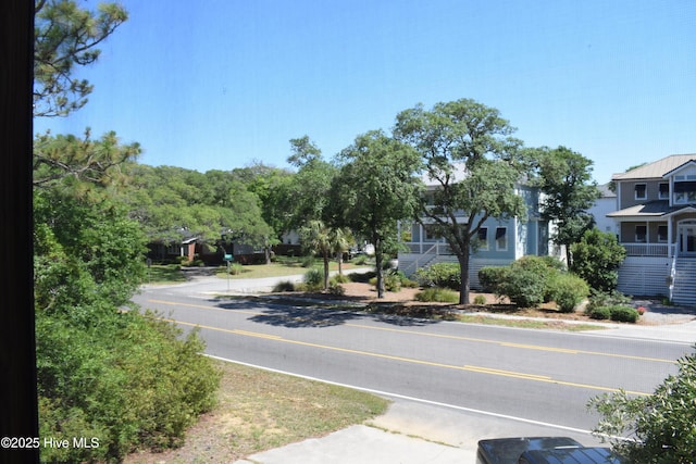 7304 E Oak Island Dr, Oak Island, NC 28465 - view of asphalt street featuring sidewalks
