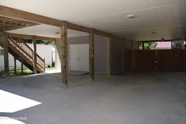 7304 E Oak Island Dr, Oak Island, NC 28465 - view of patio with stairs and an attached carport