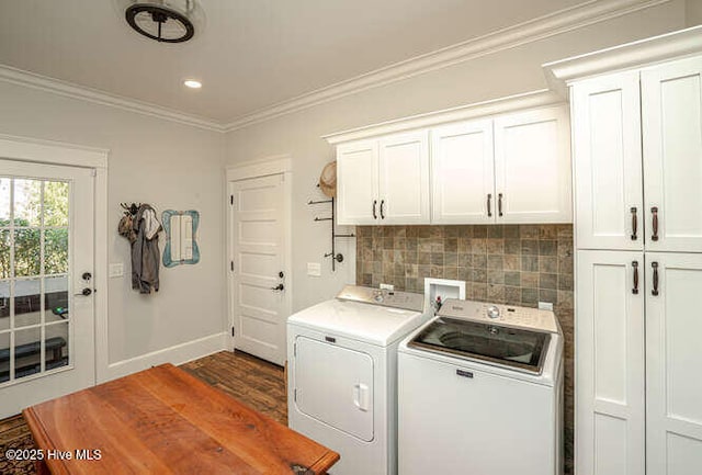 laundry area featuring cabinets, crown molding, separate washer and dryer, and dark hardwood / wood-style flooring