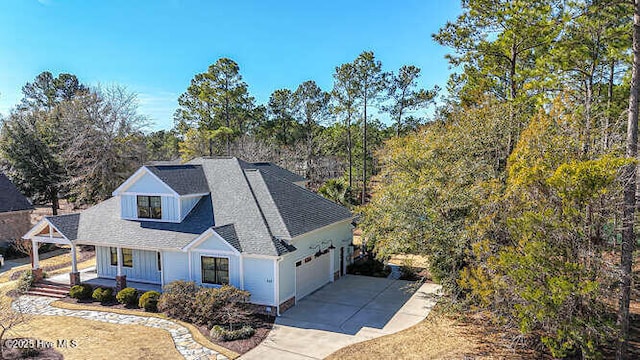 view of front of property featuring a garage and a porch