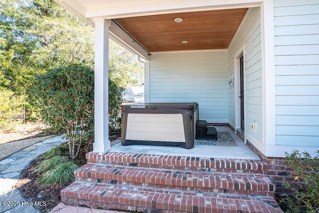 exterior details with a hot tub