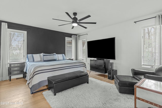 bedroom featuring light hardwood / wood-style floors and ceiling fan