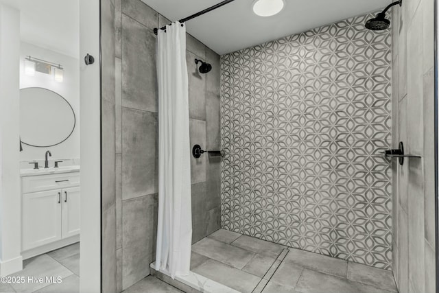 bathroom featuring vanity and curtained shower