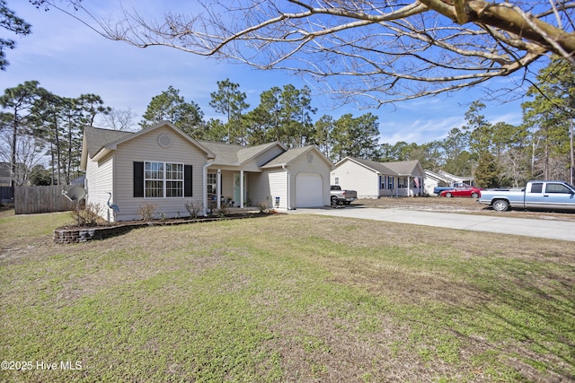 ranch-style house with an attached garage, fence, concrete driveway, and a front yard