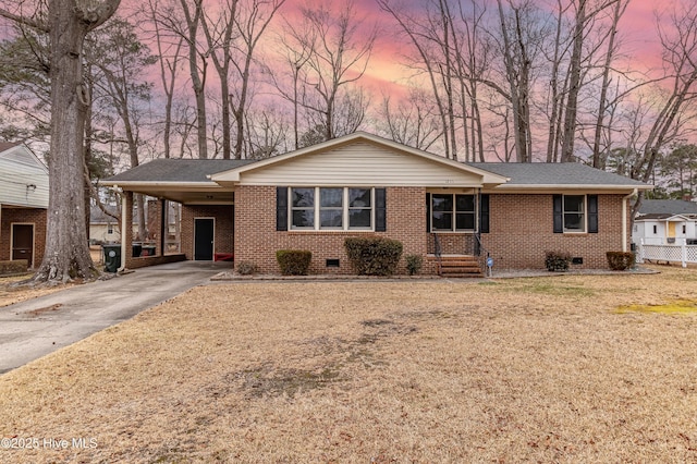 ranch-style house with a carport