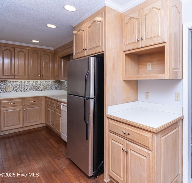 kitchen featuring dark wood-type flooring, a textured ceiling, stainless steel refrigerator, dishwasher, and decorative backsplash