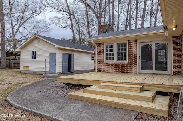 back of house featuring a wooden deck