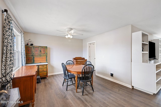 dining area featuring dark hardwood / wood-style floors and ceiling fan