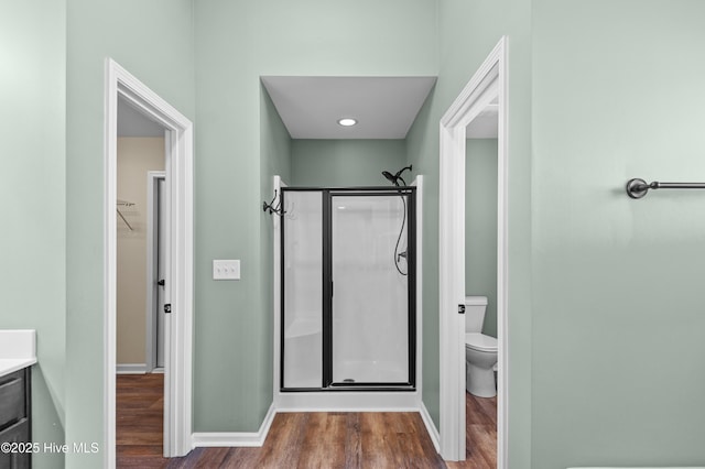 300 William Sharp Way, Jacksonville, NC 28546 - full bathroom featuring a shower stall, wood finished floors, toilet, vanity, and baseboards