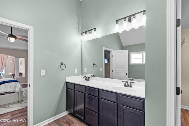 300 William Sharp Way, Jacksonville, NC 28546 - ensuite bathroom with wood finished floors, double vanity, a ceiling fan, and baseboards